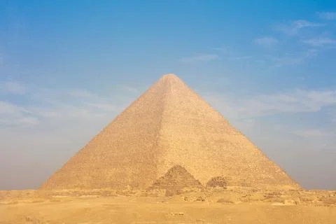 Egyptian pyramids in sand desert and clear sky. Stock Photos