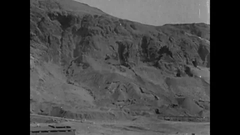 Egyptians excavate mortuary tombs at an archeological site in the cliffs of Deir Stock Footage