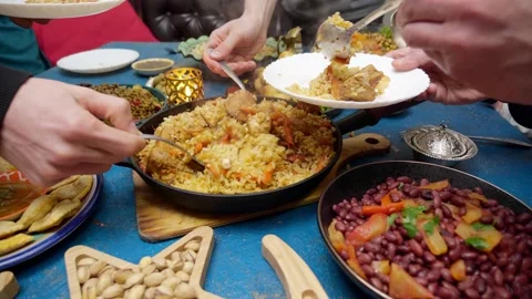 Eid al-Fitr, Ramadan. An authentic Muslim family has dinner together Stock Footage 172129237