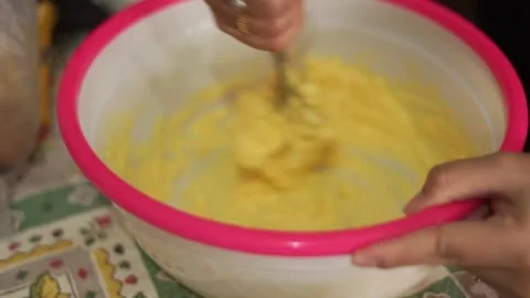 Eid cake dough is prepared in a vessel consisting of a mixture of butter, e.. Stock Footage 271211190