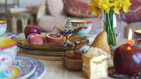 Eid Celebration Table with Fruit Plate and Blue Lantern Stock Footage 276498785