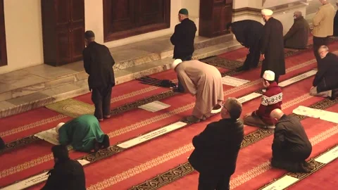 Eid Congregation Praying With Mosque Teacher Imam Who Reads Qur'an Stock Footage 157126702