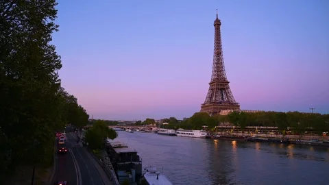 The Eiffel Tower across the Seine River at dusk in Paris, France. Stock Footage 113658386