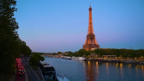 The Eiffel Tower across the Seine River at dusk in Paris, France. Stock Footage 113658448