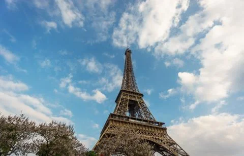 The Eiffel Tower against clouds and sky in Paris, France Stock Photos