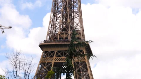 The Eiffel tower among the trees in Paris, France Stock Footage 260695516