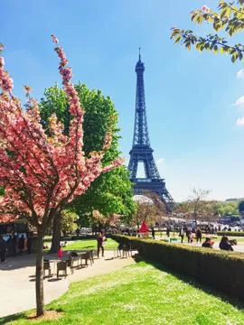 Eiffel Tower and blue sky, famous landmark in Paris, France Stock Photos