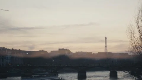 Eiffel tower and bridge over seine river at sunset Stock Footage 312999639