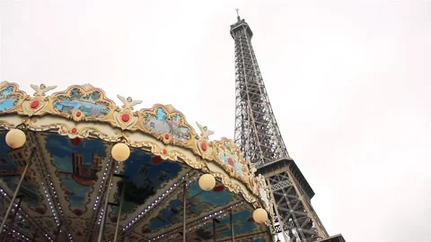 The Eiffel Tower and Carousel on a Cloudy Day in Paris, France. Slow Motion. Stock Footage 112370900