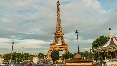 Eiffel Tower and carousel going round at amusement park in Paris, hyperlapse Stock Footage 74988870