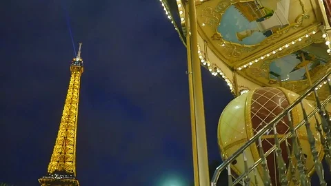 Eiffel Tower and carousel in Paris in the evening Stock Footage 77032049