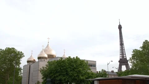 Eiffel Tower and Holy Trinity Cathedral Golden Domes in Paris France Stock Footage 335361950