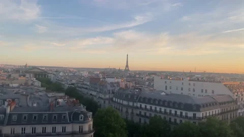 Eiffel Tower and Paris city  rooftops at sunset, 2022 Stock Footage 200874925