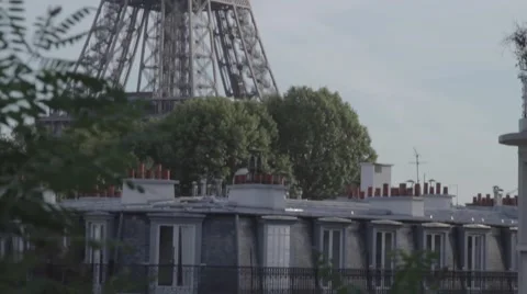 Eiffel tower and rooftops Tilt Up Stock Footage 56895626