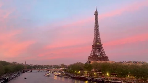 Eiffel Tower and Seine river during a romantic pink sunset Stock Footage 336035856