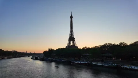 Eiffel Tower and Seine river at sunrise in Paris, France. Panning, copy space Video stock 336251330