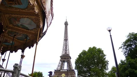 The Eiffel Tower and vintage carousel in Paris, France Stock Footage 237923915