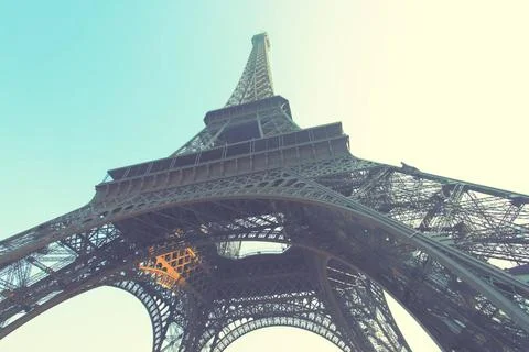 The Eiffel Tower Angle shot of The Eiffel Tower in Paris, France. Retro st... Stock Photos