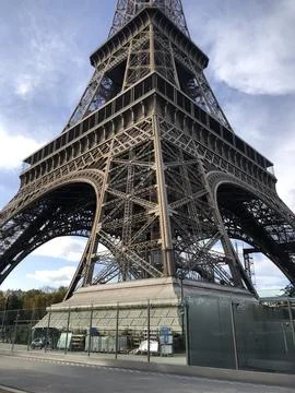 Eiffel Tower, angled view from below. Close-up. Lower part. Stock Photos