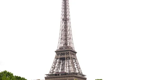 Eiffel Tower with the base covered by trees in Paris, France Stock-Footage 237924524