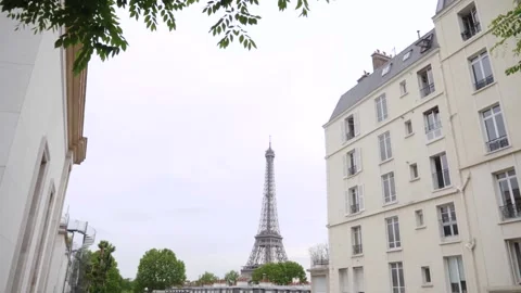 Eiffel tower between haussman buildings in Paris, France Stock Footage 237923008
