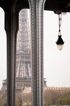 The Eiffel Tower between the pillars of the Bir Hakeim bridge in Paris on a.. Stock Photos