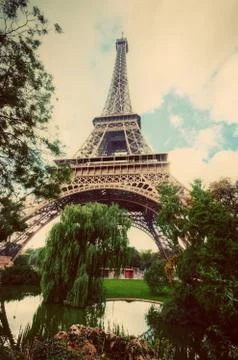 Eiffel Tower from Champ de Mars park in Paris, France. Vintage Stock Photos