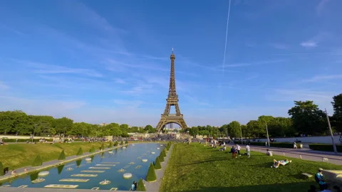 Eiffel Tower on Champs de Mars in Paris, France. Blue cloudy sky at summer day Stock Footage 210887478