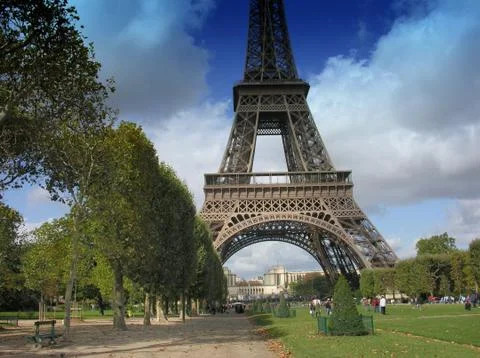 Eiffel Tower with Clouds from Champs de Mars in Paris Stock Photos