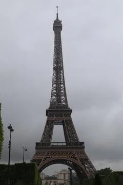 Eiffel Tower on a cloudy day, iconic French landmark in Paris. Stock Photos