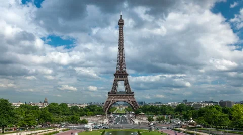 Eiffel Tower in a cloudy day with rushing clouds and busy traffic in Jena Bridge Stock Footage 62562409