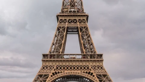Eiffel tower at dusk, Champ de Mars, Paris. Dark clouds, dramatic sky. Stock Footage 87288965
