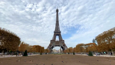 Eiffel Tower in the Fall seen from the Champs de Mars park in Paris, France Stock Footage 221864446