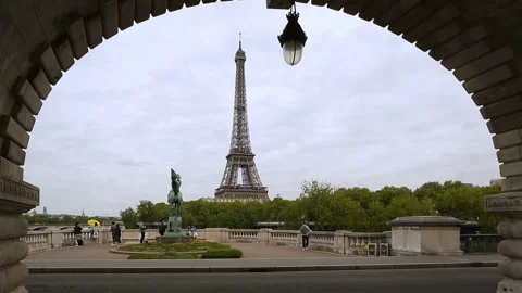 Eiffel Tower framed by the arch of the bridge Stock Footage 133769682