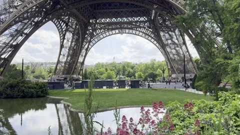 Eiffel Tower with gardens and pond in Paris, France during spring Stock Footage 337196813