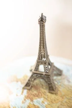 Eiffel Tower on globe. Eiffel Tower on globe. Miniature concept ,model rel... Stock-Fotos