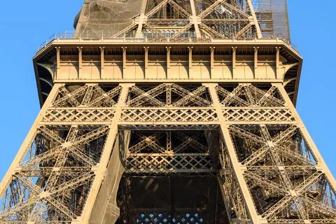 Eiffel Tower intricate iron framework in sunlight Stock Photos