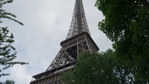 Eiffel tower iron architecture stands tall as Paris landmark in rain Stock Footage 337293774