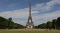 Eiffel Tower Landmark Paris Champ de Mars People Commuting Passing Walking sunny HD Footage