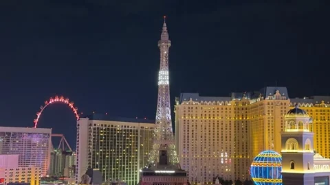 Eiffel Tower in Las Vegas lit up Red, White and Blue at night. Stock Footage 317991966