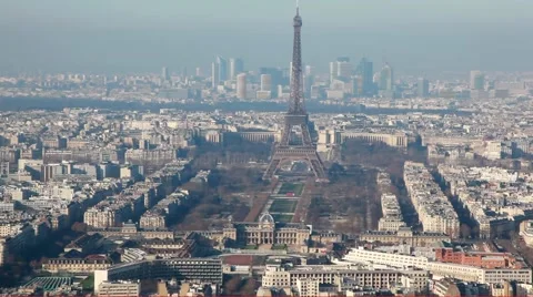 Eiffel Tower in middle of old and new buildings city Paris Stock Footage 1104797
