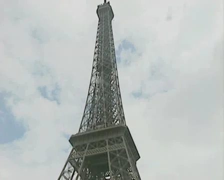 Eiffel Tower model and merry go round at base Stock Footage 8918362