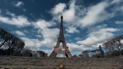 Eiffel Tower with moving clouds, Landmark in Paris with Champ de Mars, A Stock Footage 245328027