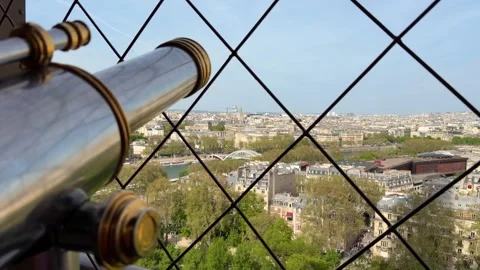 Eiffel Tower observation deck telescope overlooking Paris cityscape Stock Footage 334133947