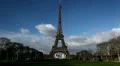 Eiffel Tower in Paris, Champ de Mars, France, People walking, passing, visiting HD Footage