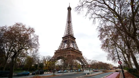 Eiffel Tower in Paris hyperlapse with falling leaves and traffic during a Stock Footage 328574032