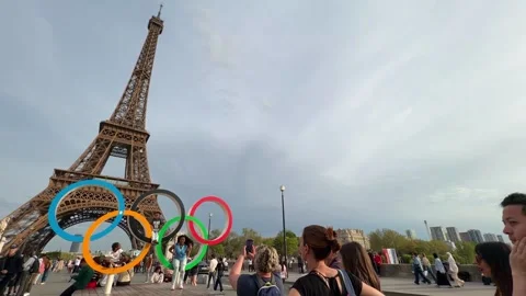 Eiffel Tower, Paris Olympics rings attracting tourists on Pont d'Iéna Stock Footage 334119312