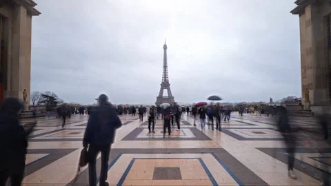 Eiffel Tower Paris push in hyperlapse with tourists on a rainy day from Video stock 328573750