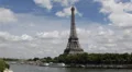 Eiffel Tower Paris Skyline Busy City Touristic Attraction Tour Boats Passing Day HD Footage