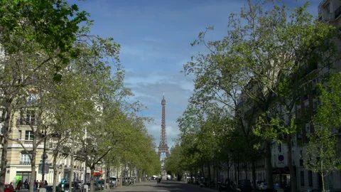 The Eiffel Tower in Paris, through the trees in Spring. Wide shot. Stock Video Stock Footage 135567147